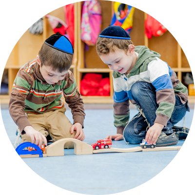 Two Younge Boys Playing with Toy Cars